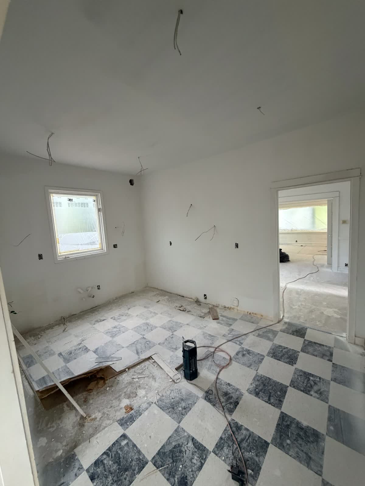 Interior demolition and flooring removal in progress